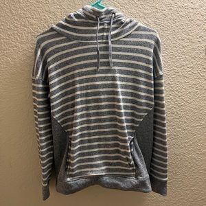 Grey and white stripped hoodie. Sits high on the neck, cozy fit